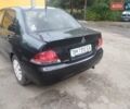 Черный Мицубиси Лансер, объемом двигателя 1.58 л и пробегом 139 тыс. км за 4600 $, фото 8 на Automoto.ua