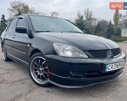 Чорний Міцубісі Lancer, об'ємом двигуна 2 л та пробігом 242 тис. км за 5900 $, фото 1 на Automoto.ua