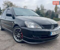 Чорний Міцубісі Lancer, об'ємом двигуна 2 л та пробігом 242 тис. км за 5900 $, фото 1 на Automoto.ua
