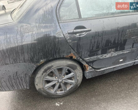 Чорний Міцубісі Lancer, об'ємом двигуна 1.58 л та пробігом 257 тис. км за 2400 $, фото 3 на Automoto.ua
