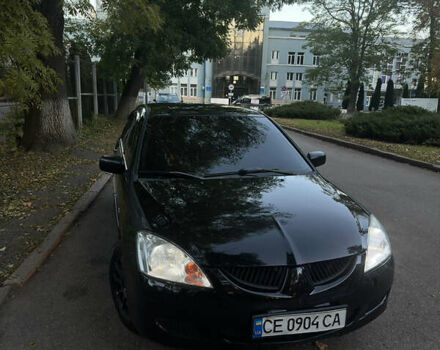 Черный Мицубиси Лансер, объемом двигателя 1.6 л и пробегом 233 тыс. км за 3650 $, фото 9 на Automoto.ua