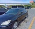 Черный Мицубиси Лансер, объемом двигателя 1.6 л и пробегом 350 тыс. км за 3500 $, фото 1 на Automoto.ua