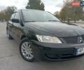 Черный Мицубиси Лансер, объемом двигателя 1.6 л и пробегом 207 тыс. км за 4500 $, фото 1 на Automoto.ua