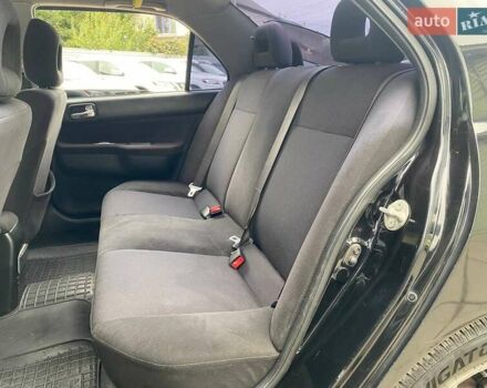Чорний Міцубісі Lancer, об'ємом двигуна 2 л та пробігом 248 тис. км за 4990 $, фото 9 на Automoto.ua