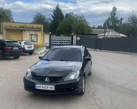 Чорний Міцубісі Lancer, об'ємом двигуна 2 л та пробігом 183 тис. км за 4500 $, фото 29 на Automoto.ua