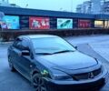 Черный Мицубиси Лансер, объемом двигателя 1.6 л и пробегом 240 тыс. км за 3900 $, фото 1 на Automoto.ua