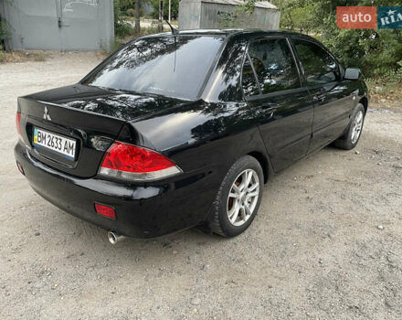Чорний Міцубісі Lancer, об'ємом двигуна 1.6 л та пробігом 240 тис. км за 4599 $, фото 5 на Automoto.ua