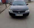 Чорний Міцубісі Lancer, об'ємом двигуна 1.6 л та пробігом 218 тис. км за 4444 $, фото 1 на Automoto.ua