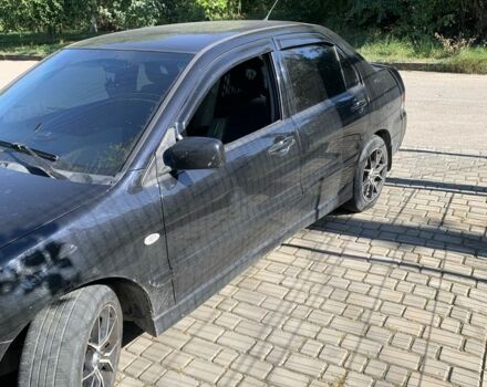 Чорний Міцубісі Lancer, об'ємом двигуна 1.6 л та пробігом 300 тис. км за 4200 $, фото 1 на Automoto.ua