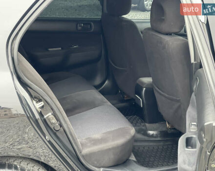 Чорний Міцубісі Lancer, об'ємом двигуна 1.58 л та пробігом 230 тис. км за 3350 $, фото 21 на Automoto.ua