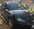 Черный Мицубиси Лансер, объемом двигателя 2 л и пробегом 220 тыс. км за 3700 $, фото 1 на Automoto.ua