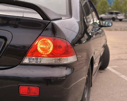 Чорний Міцубісі Lancer, об'ємом двигуна 1.58 л та пробігом 230 тис. км за 4350 $, фото 7 на Automoto.ua