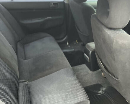 Чорний Міцубісі Lancer, об'ємом двигуна 1.58 л та пробігом 230 тис. км за 3350 $, фото 6 на Automoto.ua