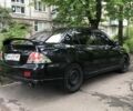 Чорний Міцубісі Lancer, об'ємом двигуна 2 л та пробігом 600 тис. км за 4198 $, фото 1 на Automoto.ua