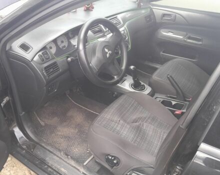 Черный Мицубиси Лансер, объемом двигателя 1.6 л и пробегом 260 тыс. км за 3800 $, фото 6 на Automoto.ua