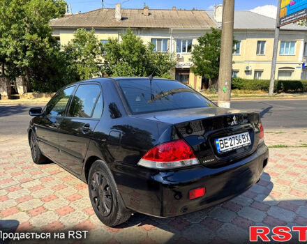 Черный Мицубиси Лансер, объемом двигателя 1.6 л и пробегом 300 тыс. км за 3599 $, фото 7 на Automoto.ua