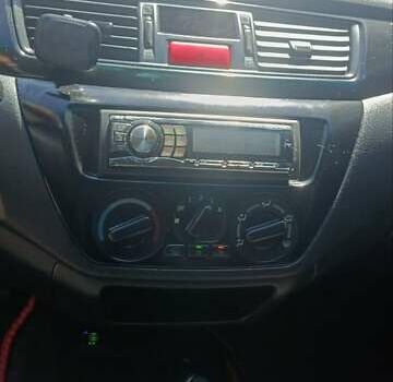 Чорний Міцубісі Lancer, об'ємом двигуна 1.6 л та пробігом 240 тис. км за 3900 $, фото 8 на Automoto.ua