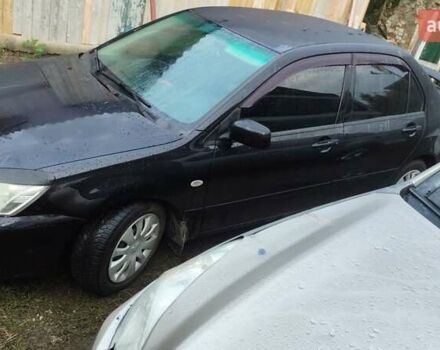 Чорний Міцубісі Lancer, об'ємом двигуна 1.58 л та пробігом 180 тис. км за 5000 $, фото 3 на Automoto.ua