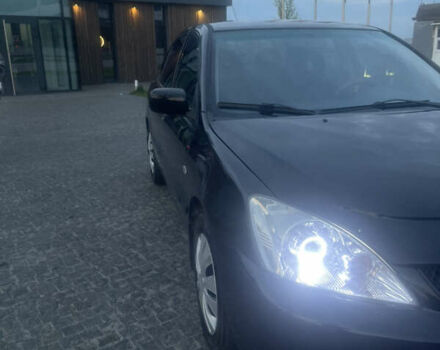 Черный Мицубиси Лансер, объемом двигателя 1.6 л и пробегом 231 тыс. км за 4250 $, фото 2 на Automoto.ua