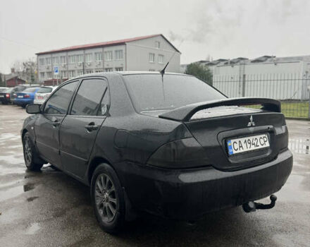 Черный Мицубиси Лансер, объемом двигателя 1.6 л и пробегом 368 тыс. км за 3200 $, фото 5 на Automoto.ua