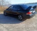 Чорний Міцубісі Lancer, об'ємом двигуна 1.58 л та пробігом 255 тис. км за 4150 $, фото 1 на Automoto.ua