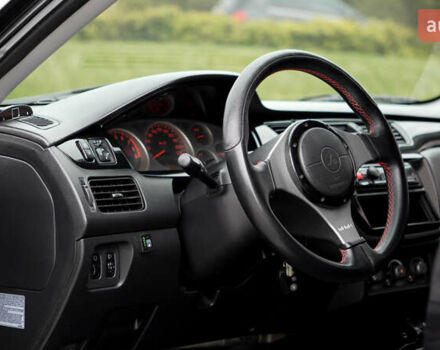 Черный Мицубиси Лансер, объемом двигателя 2 л и пробегом 253 тыс. км за 6900 $, фото 8 на Automoto.ua