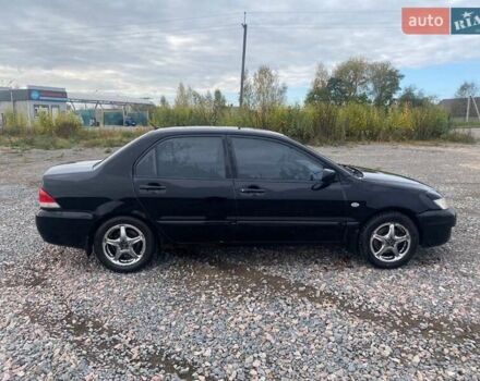 Чорний Міцубісі Lancer, об'ємом двигуна 1.6 л та пробігом 335 тис. км за 3500 $, фото 4 на Automoto.ua