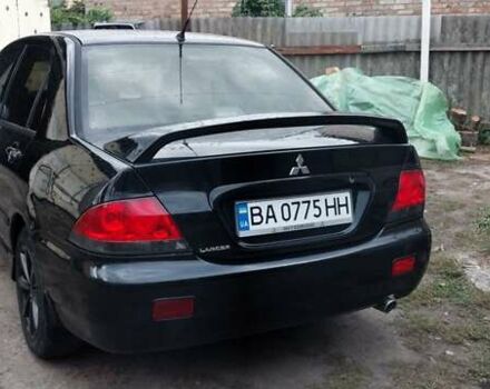 Чорний Міцубісі Lancer, об'ємом двигуна 1.59 л та пробігом 185 тис. км за 4900 $, фото 10 на Automoto.ua