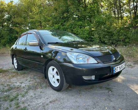 Черный Мицубиси Лансер, объемом двигателя 1.6 л и пробегом 289 тыс. км за 3200 $, фото 12 на Automoto.ua