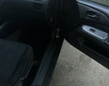 Черный Мицубиси Лансер, объемом двигателя 1.6 л и пробегом 233 тыс. км за 3650 $, фото 12 на Automoto.ua