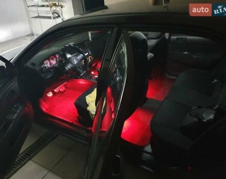 Чорний Міцубісі Lancer, об'ємом двигуна 1.58 л та пробігом 222 тис. км за 2999 $, фото 7 на Automoto.ua