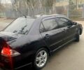 Чорний Міцубісі Lancer, об'ємом двигуна 2 л та пробігом 308 тис. км за 4800 $, фото 3 на Automoto.ua