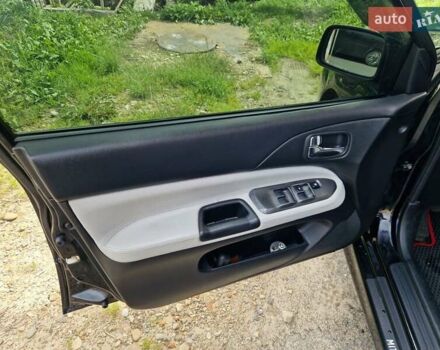 Черный Мицубиси Лансер, объемом двигателя 2 л и пробегом 168 тыс. км за 4999 $, фото 9 на Automoto.ua