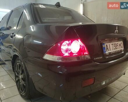 Чорний Міцубісі Lancer, об'ємом двигуна 1.58 л та пробігом 222 тис. км за 2999 $, фото 8 на Automoto.ua