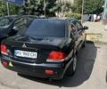 Черный Мицубиси Лансер, объемом двигателя 1.6 л и пробегом 320 тыс. км за 3493 $, фото 1 на Automoto.ua