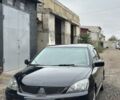 Черный Мицубиси Лансер, объемом двигателя 2 л и пробегом 222 тыс. км за 4000 $, фото 1 на Automoto.ua