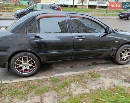 Черный Мицубиси Лансер, объемом двигателя 1.58 л и пробегом 270 тыс. км за 4000 $, фото 8 на Automoto.ua