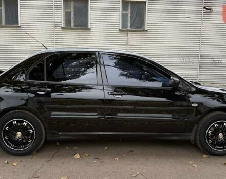 Чорний Міцубісі Lancer, об'ємом двигуна 1.58 л та пробігом 386 тис. км за 4450 $, фото 6 на Automoto.ua