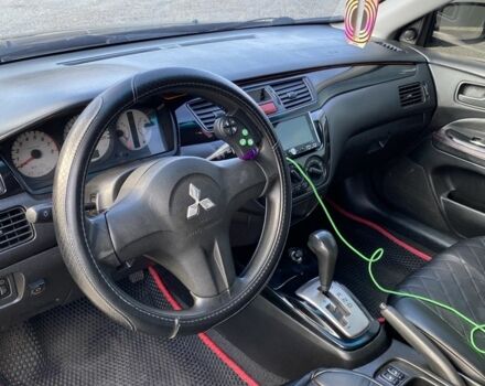 Черный Мицубиси Лансер, объемом двигателя 1.6 л и пробегом 200 тыс. км за 3400 $, фото 4 на Automoto.ua