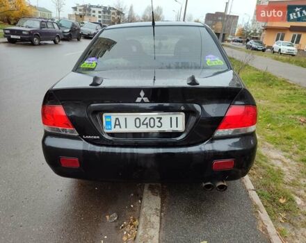 Черный Мицубиси Лансер, объемом двигателя 1.58 л и пробегом 270 тыс. км за 4000 $, фото 6 на Automoto.ua