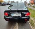 Черный Мицубиси Лансер, объемом двигателя 1.58 л и пробегом 270 тыс. км за 4000 $, фото 6 на Automoto.ua