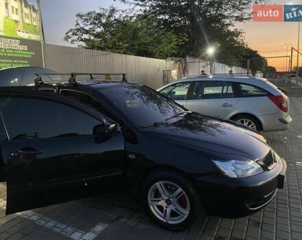 Черный Мицубиси Лансер, объемом двигателя 1.6 л и пробегом 257 тыс. км за 4500 $, фото 3 на Automoto.ua