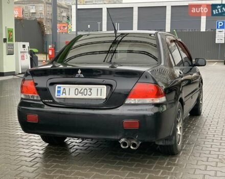 Чорний Міцубісі Lancer, об'ємом двигуна 1.58 л та пробігом 270 тис. км за 3950 $, фото 4 на Automoto.ua