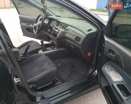 Чорний Міцубісі Lancer, об'ємом двигуна 1.58 л та пробігом 290 тис. км за 3200 $, фото 13 на Automoto.ua