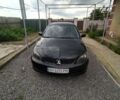 Черный Мицубиси Лансер, объемом двигателя 2 л и пробегом 260 тыс. км за 4100 $, фото 1 на Automoto.ua