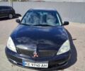 Чорний Міцубісі Lancer, об'ємом двигуна 1.58 л та пробігом 128 тис. км за 4600 $, фото 1 на Automoto.ua
