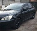 Чорний Міцубісі Lancer, об'ємом двигуна 1.59 л та пробігом 185 тис. км за 4900 $, фото 1 на Automoto.ua