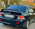 Міцубісі Lancer 2006 у Дніпро (Дніпропетровську) на Automoto.ua Чорний Міцубісі Lancer, об'ємом двигуна 2 л та пробігом 230 тис. км за 4900 $, фото 10 на Automoto.ua