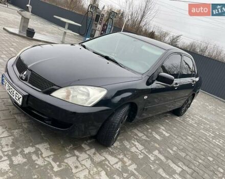 Чорний Міцубісі Lancer, об'ємом двигуна 1.58 л та пробігом 282 тис. км за 4100 $, фото 8 на Automoto.ua
