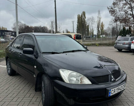 Черный Мицубиси Лансер, объемом двигателя 1.58 л и пробегом 370 тыс. км за 3500 $, фото 2 на Automoto.ua